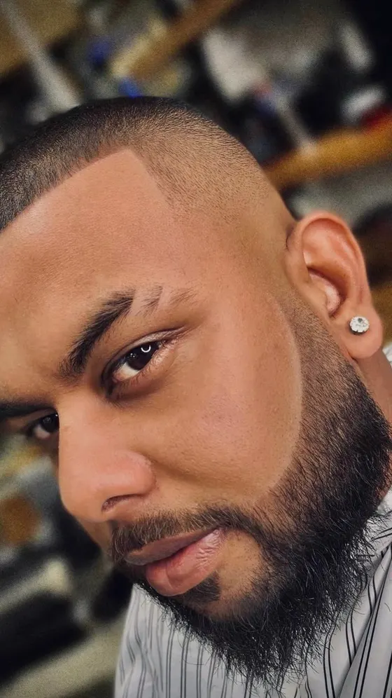 A finished fade and beard line, close up