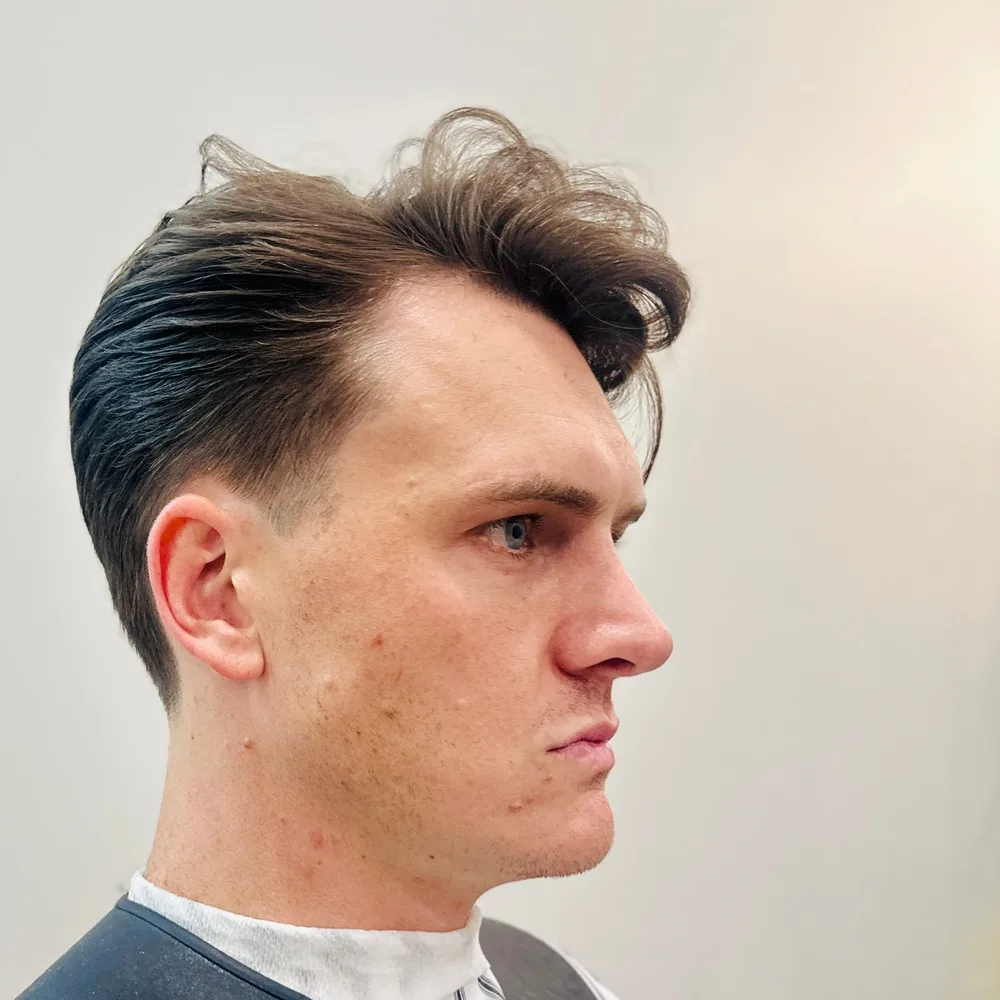 Blonde quiff with a scissor-cut top