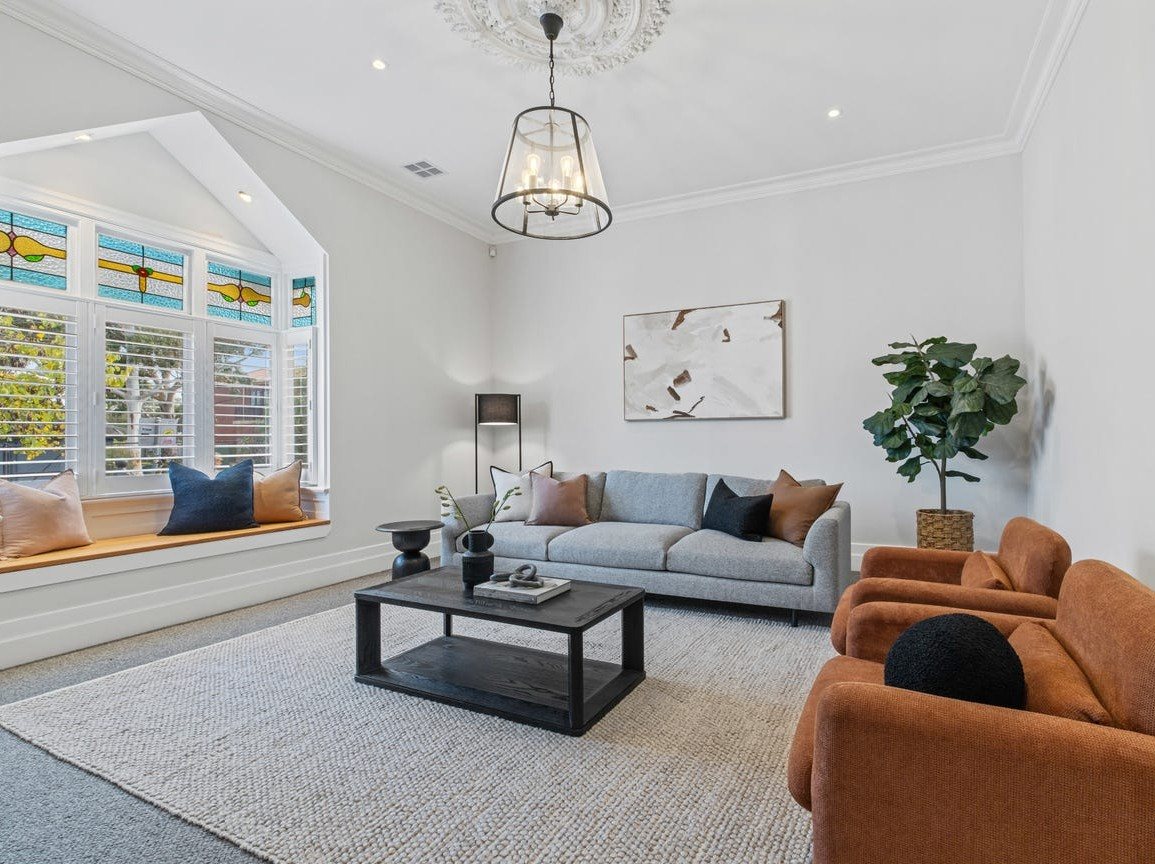 Restored front lounge with leadlight windows and a ceiling rose