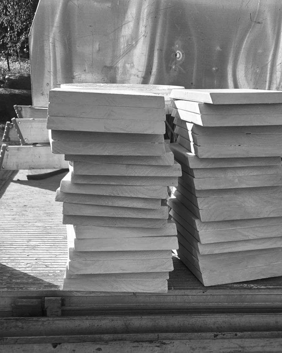 Stacked slabs of natural stone on site at Brighton, selected before installation.