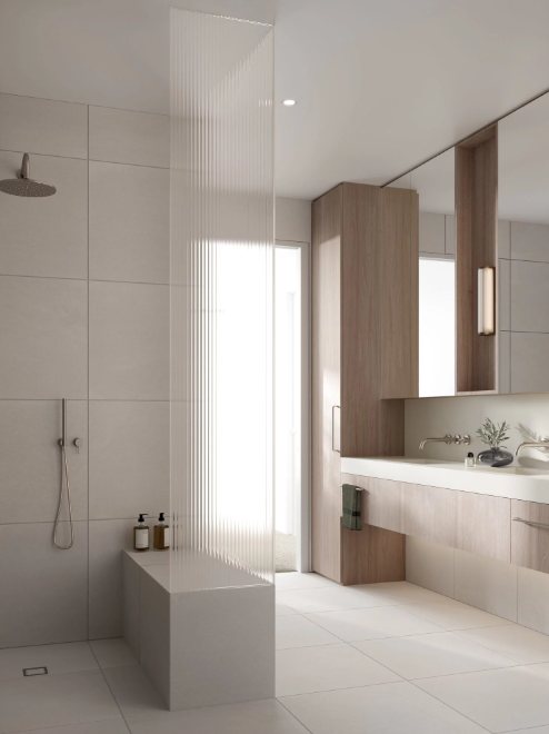 Bathroom with a freestanding stone bath, a walk-in shower behind a glass screen and warm minimal tiling.